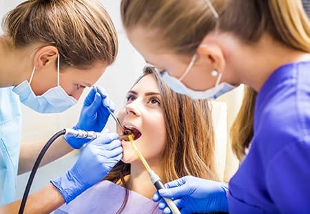 How are cavities treated?
